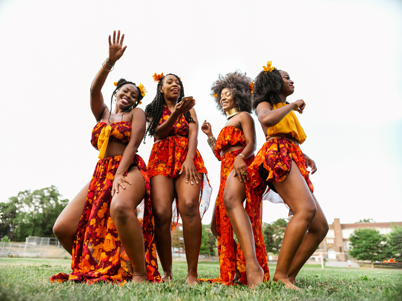 Young black women dancing in the field
